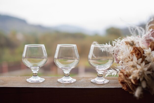 Three glasses with whiskey on the table