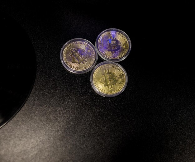 Three Gold Bitcoin Cryptocurrency Coins