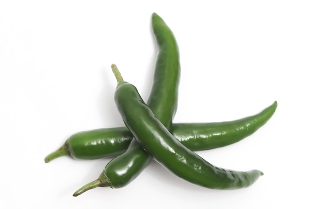 Three green hot chili pepper top view isolated on white background clipping path