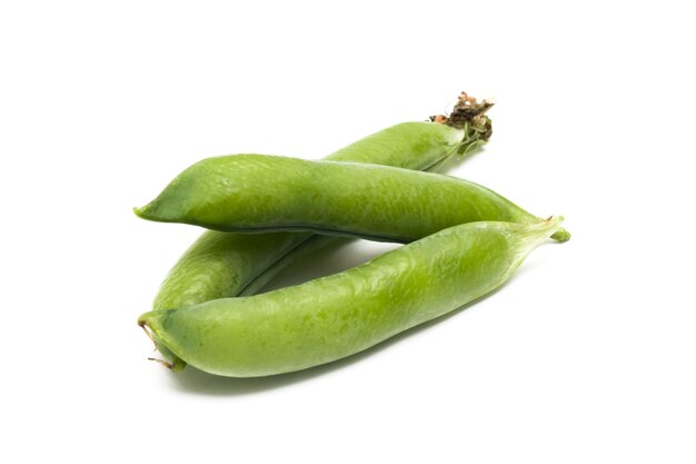 Three green peas pod on white background