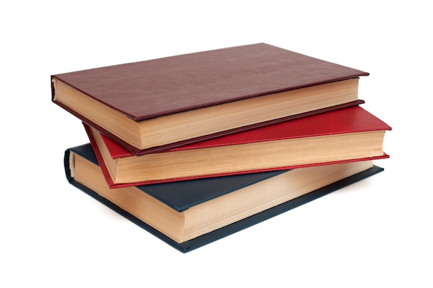 Photo three hardback books lie on a white background