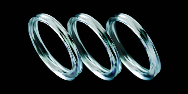 three intertwined glass rings on black background