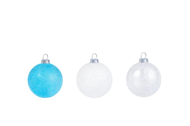 three isolated shiny christmas ornaments closeup