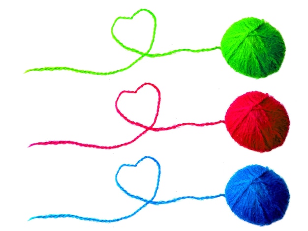 Three of knitting yarn on white background