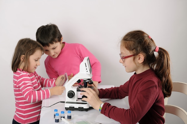 Three little girls studying