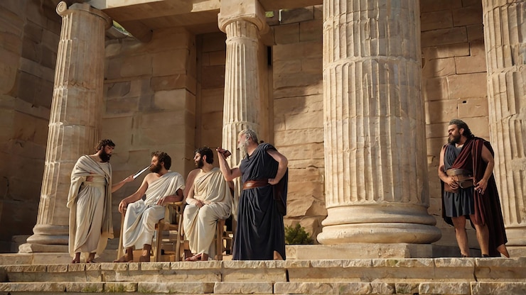 Photo three men are sitting on the steps of a building