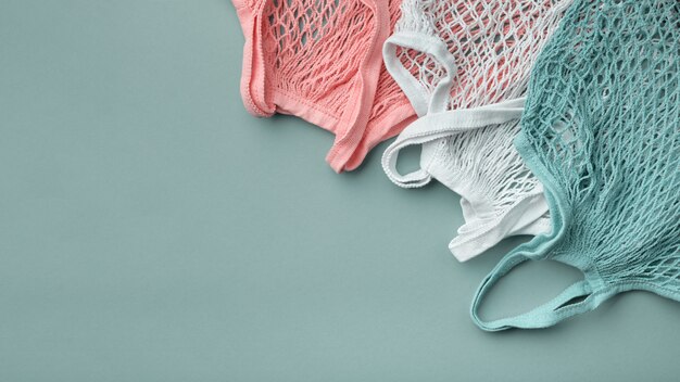 Three mesh bags of different colors