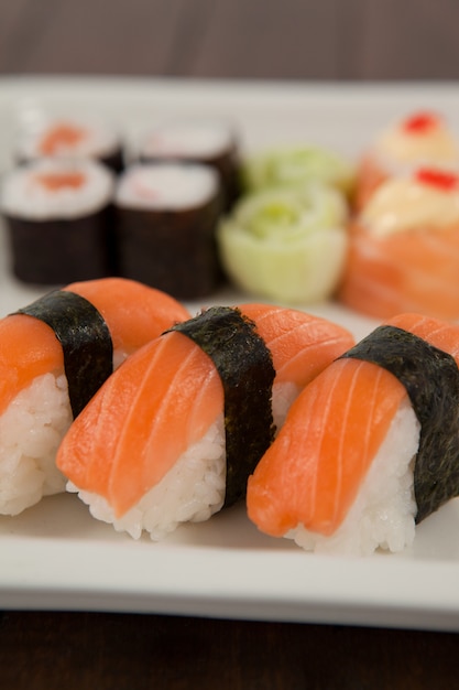 Three nigiri sushi served in white plate