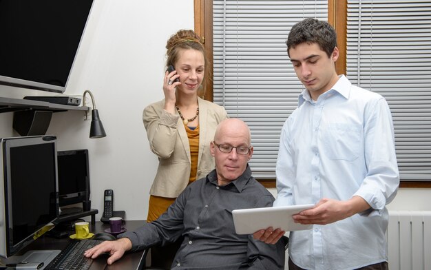 Three people in an office