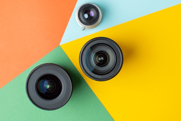 Three photo lenses, on a colored background, a set of photo devices for the camera