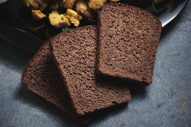 Photo three pieces of black bread close up