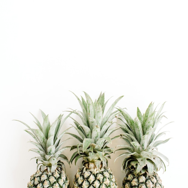 Three pineapples with leaves