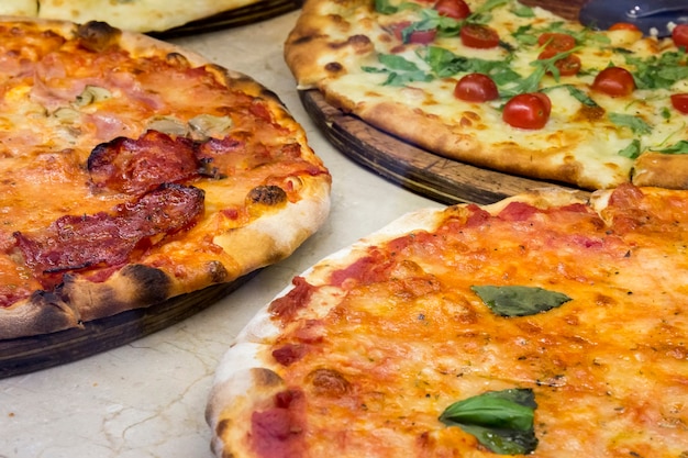 Three pizzas made on traditional oven