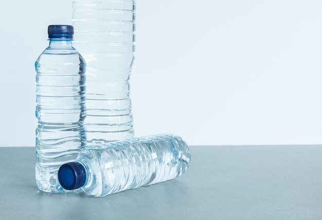 https://img.freepik.com/premium-photo/three-plastic-bottles-filled-with-mineral-water-white-background_163068-88.jpg?size=626&ext=jpg