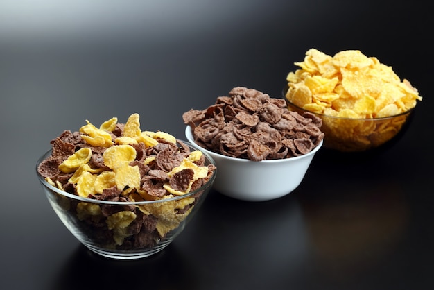 Three plates with different corn flakes
