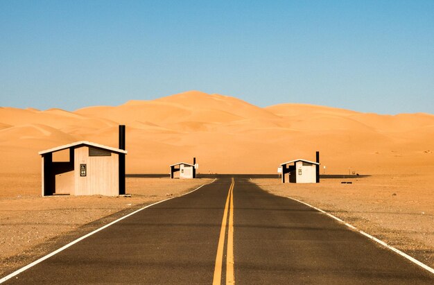 Photo three public restrooms in parking lot of imperial sand dunes