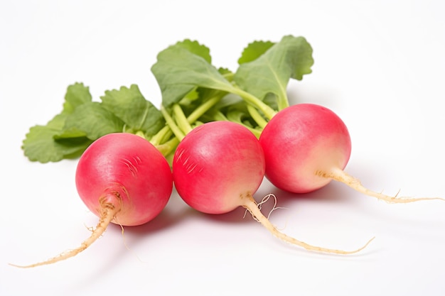 three radishes with leaves on a white surface