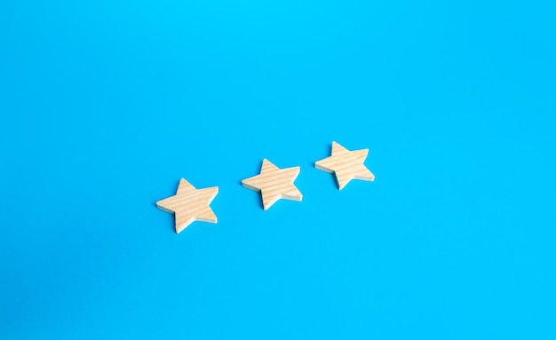 Three rating stars rating evaluation concept service quality\
high satisfaction popularity of a restaurant hotel or mobile\
applications good reputation status buyer feedback