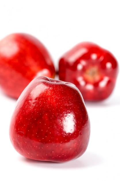 Three red apples isolated on white background