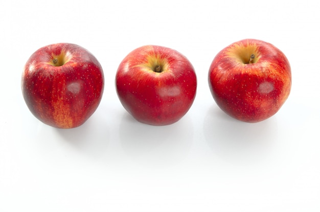 Three red apples in a row