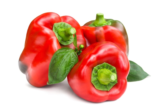 Three red bell peppers isolated