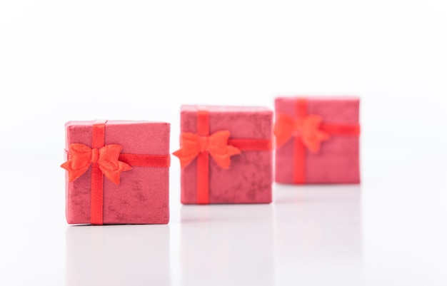Three red gifts on white background