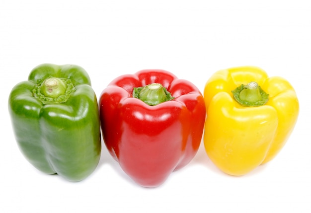 Three red pepper, green and yellow