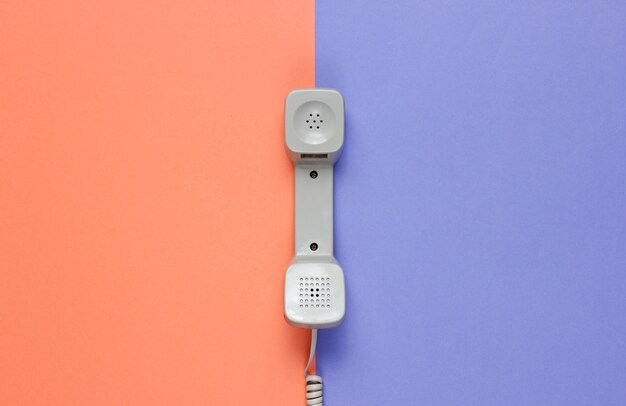 Three Retro telephone handset on neon color