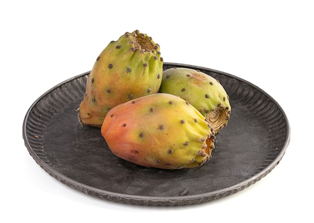 Three ripe prickly pears on a white background