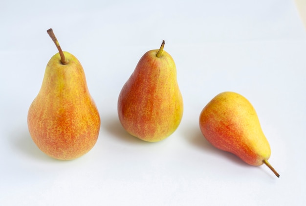 Three ripe red and yellow pears isolated