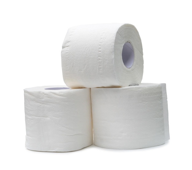 Three rolls of white tissue paper or napkin in stack prepared for use in toilet or restroom isolated on white background with clipping path