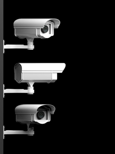 写真 黒い背景に分離された 3 つのセキュリティ監視カメラの側面図