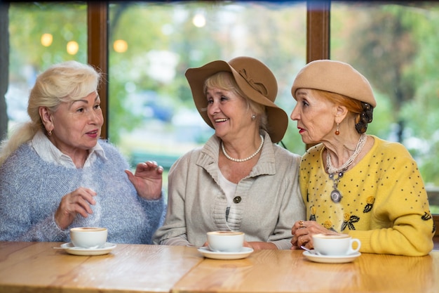 Three senior ladies at table