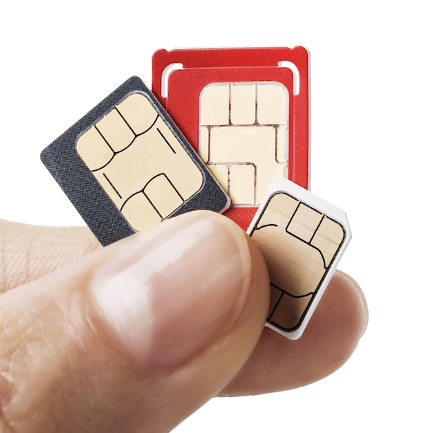 Three SIM cards in hand isolated on white background