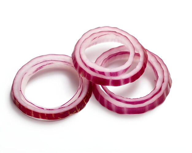 Photo three slices of red onion are stacked on top of each other.