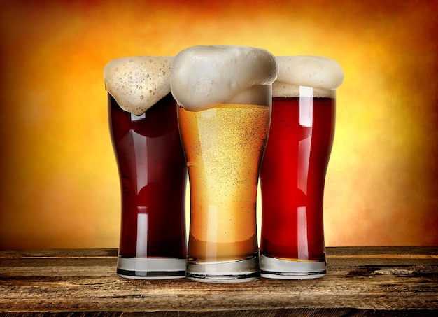 Three sorts of beer on a wooden table