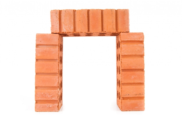 Three stacked red bricks