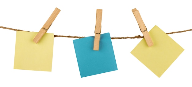 Photo three sticky notes hanging on twine attached with clothespins - isolated