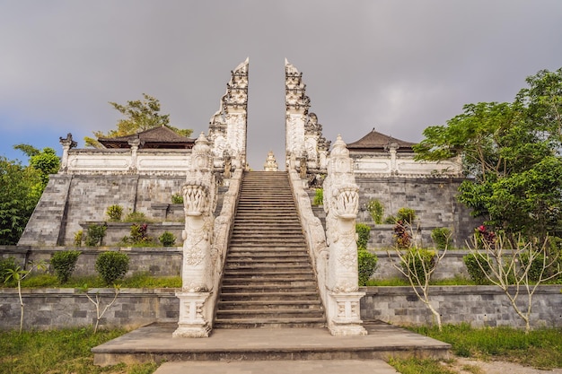 Three stone ladders in beautiful Pura Lempuyang Luhur temple Summer landscape with stairs to temple Paduraksa portals marking entrance to middle sanctum jaba tengah of Pura Penataran Agung Bali