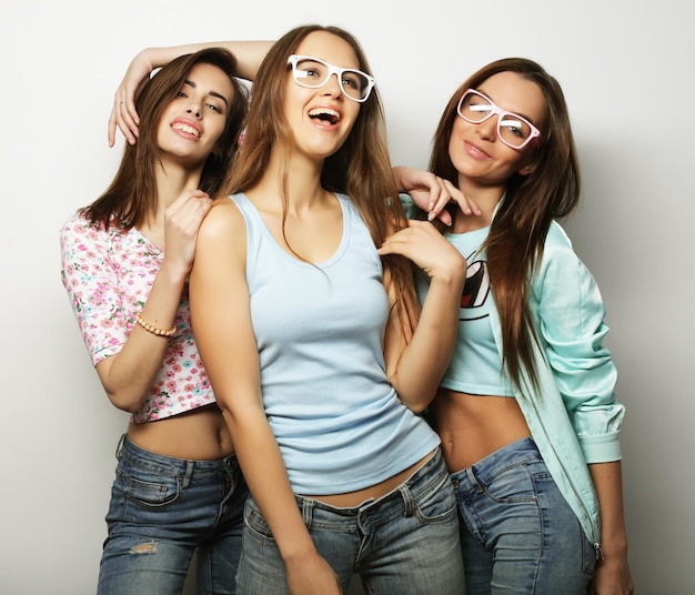 Three stylish sexy hipster girls best friends