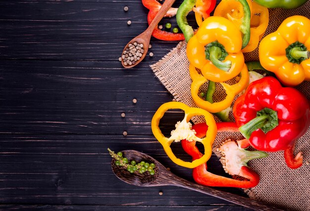 Three sweet peppers on a wooden background, Cooking vegetable salad