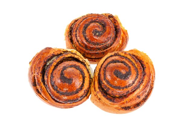 Three tasty rolls buns with poppy seeds on a white background