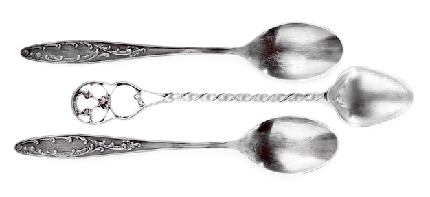 Three teaspoons isolated on white