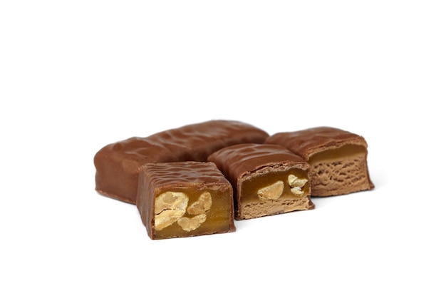 Three types of chocolate sweets with nougat, caramel and nuts.