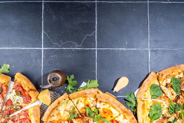 Three various served pizzas