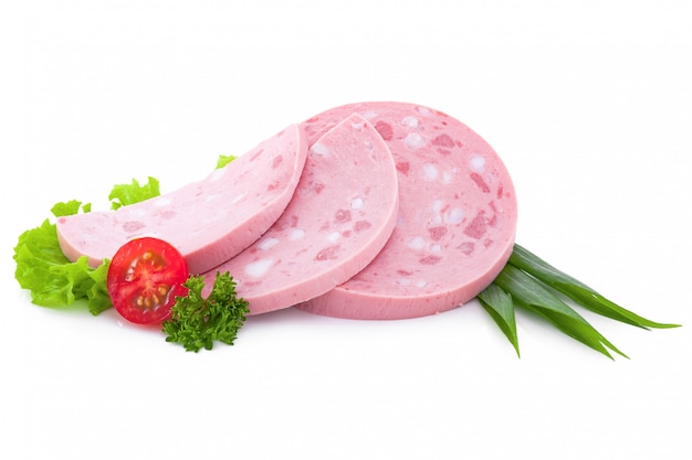 Three very thin slices of boiled sausage are stacked on a plate