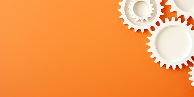 Photo three white gears on a orange background laid flat copy space concept for business technology and de