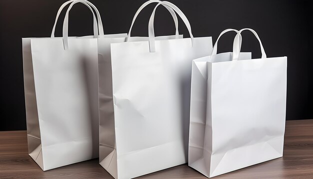 Three white paper bags are lined up on a table.