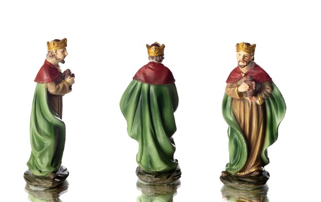 The three wise men. Ceramic figures isolated on white background