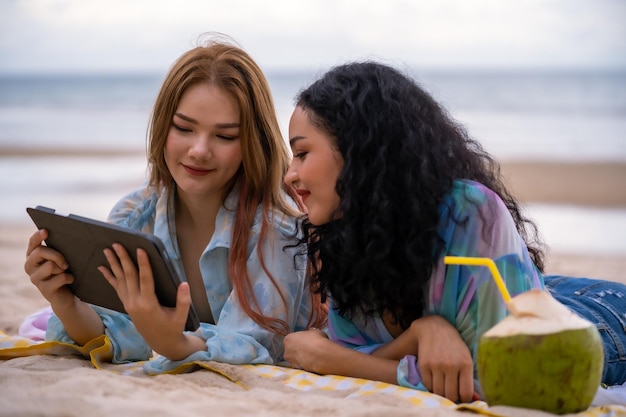 Three Women LGBT Relationship summer holiday on the beach.